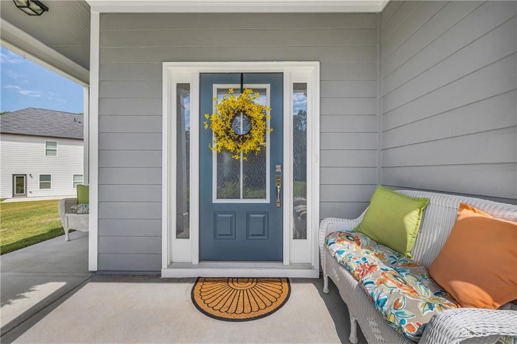 **BRAND NEW PRICE IMPROVEMENT - DON'T MISS THIS OPPORTUNITY!!** Welcome to Your Dream Home in Quail Forest – Where Every Detail Feels Just Right
Imagine pulling into a quiet, storybook neighborhood, where warm curb appeal and thoughtful design welcome you at every turn. Step onto the charming covered wraparound front porch and into a home that feels like it was made just for you.
Only one year old, this home has already been lovingly brought to life by its current owners—adding warmth, character, and style that go far beyond new construction. Every inch has been thoughtfully curated to create an atmosphere of calm, comfort, and connection.
As you walk through the front door, you're instantly greeted by natural light pouring through windows, softened by custom blinds and light-filtering accents that strike the perfect balance between brightness and privacy. The open-concept living area, with soaring 9-foot ceilings on the main level, invites you in—complete with rich Mohawk LVP flooring throughout, an electric fireplace that adds instant coziness, and designer touches that make the entire space feel elevated yet welcoming.
At the heart of the home, the kitchen is a true showstopper. With wrap-around cabinetry, granite countertops that shine under recessed lighting, a full Whirlpool Gold stainless steel appliance package, and a generous island—this is where everyone will want to gather. Whether hosting a holiday meal or enjoying a quiet breakfast, it’s an Entertainer’s Dream—seamlessly connected to the Family Room so the chef is always part of the conversation.
Just off the kitchen, a short hallway leads to a spacious walk-in closet—ideal as a second pantry or storage space—and the two-car garage, upgraded with a MyQ smart garage door system for remote access and added peace of mind.
A stylish and handy powder room is also located on the main level—an added perk for guests and everyday convenience without needing to go upstairs.
As you ascend the beautiful hardwood stairs with open metal railing, you'll appreciate the thoughtful split-bedroom layout that ensures the primary suite is tucked away for privacy. The primary suite is spacious and serene, offering a true retreat at the end of the day. It features a tray ceiling, spa-inspired ensuite with a soaking tub, a walk-in enclosed shower, double marble vanity, private water closet, and a large walk-in closet.
Down the hall, you’ll find two generously sized secondary bedrooms—perfect for family, guests, or a home office setup—and a beautifully finished full bathroom to share. The full bonus room is a wonderful surprise—privately tucked behind its own entry door and hallway, it offers endless possibilities as a fourth bedroom, media room, or quiet office. The upstairs laundry room adds everyday ease, conveniently located near all the bedrooms.
Outdoor living is just as special here—from sipping morning coffee on the wraparound front porch as the sun rises, to grilling and entertaining on the concrete back patio while watching vibrant sunsets over Quail Forest. The peaceful, tree-lined setting adds to the charm, making every moment feel like home.
? Only one year old and still under the builder’s warranty (transferable through December 2025)
? Lovingly maintained with upgraded finishes throughout – truly move-in ready
Why You’ll Love Living in Quail Forest:
Peaceful, close-knit community with small-town charm
Just minutes from Toccoa Falls, Currahee Vineyard & Winery, the Historic Ritz Theatre, and Lake Hartwell
Surrounded by nature—hiking at Currahee Mountain, weekend trips to the North Georgia Mountains, and easy access to waterfalls, rivers, and scenic lake views
Convenient to both Hwy 365 & I-85 for commuting and travel
This is more than a house—it’s the home you’ve been dreaming about. Schedule your private showing today.
