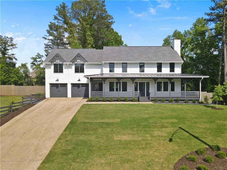 Step into modern elegance in this fully renovated East Cobb gem, ideally located in the top-rated Walton High School district. Completely rebuilt from the framing up, this home combines timeless charm with high-end design and craftsmanship. The light-filled kitchen features stunning quartzite countertops, designer lighting, and a spacious island perfect for entertaining. Each bedroom offers its own ensuite bath, and the vaulted primary suite feels like a private retreat—complete with a spa-like, borderless shower and sleek, upgraded fixtures. Enjoy morning coffee or evening gatherings in the beautifully landscaped and fenced backyard, with both deck and side yard space for play or relaxation. With everything brand new—roof, systems, finishes—this is a rare opportunity to lease a practically new home in one of Marietta’s most sought-after locations.