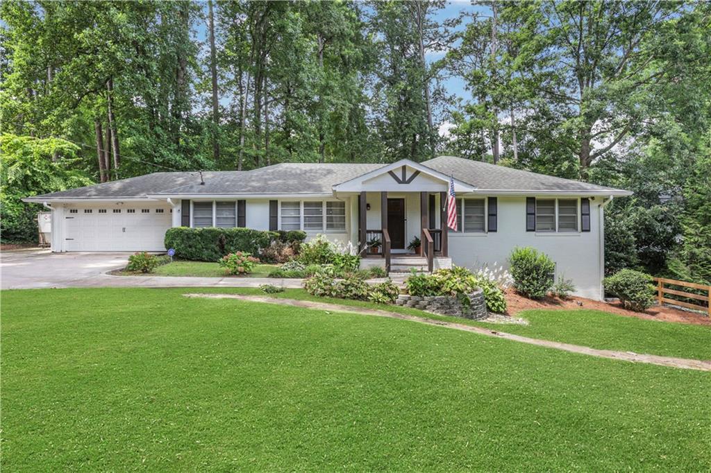 This stylishly renovated home is a perfect blend of contemporary living and mid-century modern charm perfect for whoever wants to be in a convent location in town, and would love to be in the highly sought after Oak Grove Elementary and Lakeside High School district. This 3 Bedroom, 2 Bath home offers light-filled spacious living spaces as well as a wonderful backyard, perfect for both relaxing and entertaining. Step inside from the welcoming newly added front porch and admire the open and airy living room with an open concept that sees the living room flow into the dining room and kitchen seamlessly. The kitchen has newer appliances and expansive island, perfect for entertaining. Off the kitchen and living room is a wonderful sitting room, perfect for a play area, office or sitting room. An attached two-car garage is conveniently located just off the kitchen. Down the hall you will find a newly renovated full bath with phenomenal tile work. The three bedrooms are at the end of the hall and the two smaller bedrooms still offer plenty of space and get a great amount of natural light. The master suite is quite ample and comes with its own newly renovated ensuite bathroom. Downstairs is a perfect flex space, currently used as a man-cave, but could be converted into a home gym, office or anything else you could dream up! Off of this part of the home, there is a great amount of storage and the laundry area with convenient outdoor access. From the dining room you step out to a perfect addition, a heated and cooled sun room, and out one more door you will fin the beautiful patio, extending the living space outdoors, all with a private fenced backyard. The outdoor space has a tranquil sitting area at the back corner and a small garden for anybody with a green thumb. You'll love the proximity to all the award winning schools, shopping areas, parks and playgrounds that the area has to offer. In addition, this home boasts some of the easiest access to get you around to all the city has to offer with its proximity to I-85 and Clairmont Road. The renovated bathrooms, updated kitchen, outdoor spaces and numerous possibilities make this a wonderful home for the right buyer!