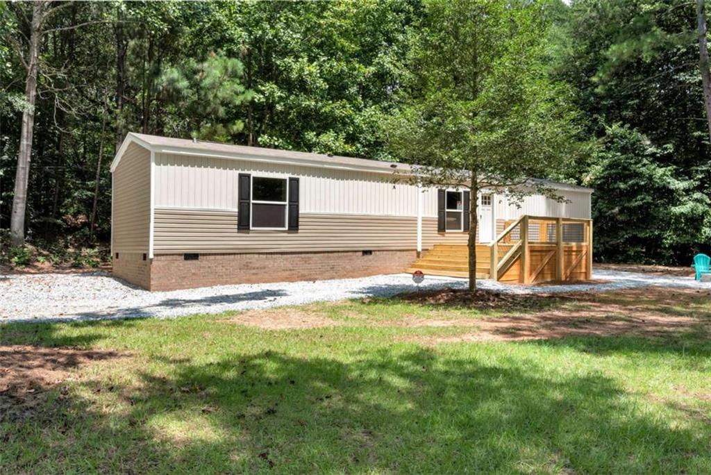 Are you dreaming of a tranquil home by the lake? This immaculate mobile home is move-in ready and boasts a wealth of fantastic features, all just steps from stunning Lake Hartwell! **Property Highlights:** - 2 Bedrooms / 2 Full Baths - Versatile bonus room that can easily serve as a 3rd bedroom - Expansive kitchen island with double pantries for ample storage - Partially furnished-just bring your essentials and settle in! - Nestled on a generous 1/2 acre lot - Only 5 minutes away from 3 convenient boat ramps - Less than 0.5 miles from the popular Gumlog BBQ - Close proximity to Tugalo State Park for outdoor adventures - A short walk to the scenic shores of Lake Hartwell Whether you seek a year-round residence, a cozy weekend retreat, or an income-generating rental, this property perfectly combines location and comfort. Don't let this opportunity pass by-schedule your showing today!