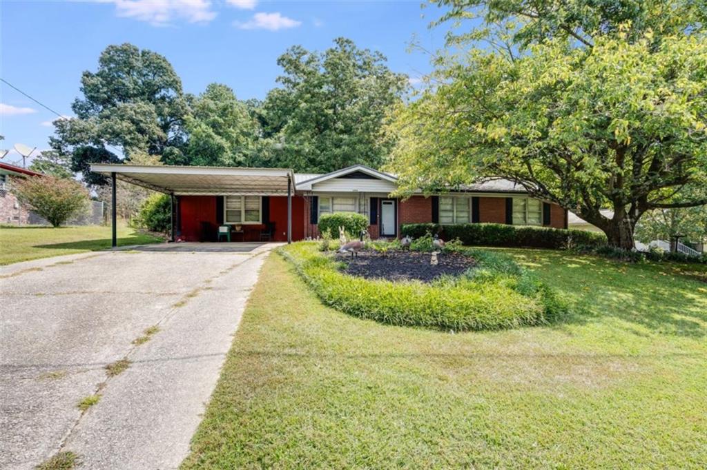 Welcome to this inviting four-sided brick home featuring 3 bedrooms and 1.5 bathrooms. Enjoy the timeless appeal and durability of brick construction, offering both style and low maintenance. Step outside to a large, fenced-in backyard-ideal for pets, play, or relaxing outdoors. Located in a friendly neighborhood with easy access to schools, shopping, and parks, this home combines comfort, and practicality. Don't miss the opportunity to make this delightful property your own!