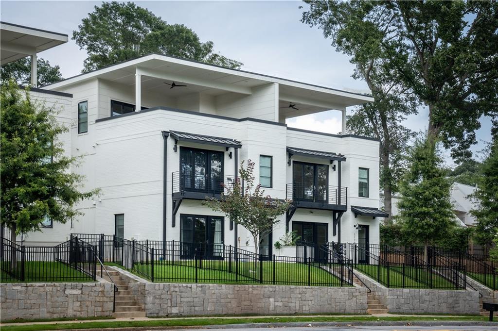 Welcome Home! Live life ON the TROLLEY LINE TRAIL just steps from the Atlanta Beltline, Madison Yards, Atlanta Dairies, Lang Carson Park & more! The Alley provides an unparalleled Intown lifestyle for modern living. Featuring 4 spacious bedrooms, 3.5 luxurious baths, media room, 2-car garage, & Atlanta's best covered rooftop deck, this home was made for entertaining! Open floor plan centered by chef's kitchen w/ SS appliances, quartz counters, waterfall island, custom fixtures, & floor to ceiling windows! Retreat to primary suite w/ custom tile shower, double vanity, walk-in closet & private balcony! Private fenced in front yard, incredible storage throughout the home, luxurious finishes, and a matchless location in the center of EVERYTHING. Close proximity to Edgewood Retail, Inman Park, Krog Street Market, Glenwood Park, and of course....THE BELTLINE! Brilliant!