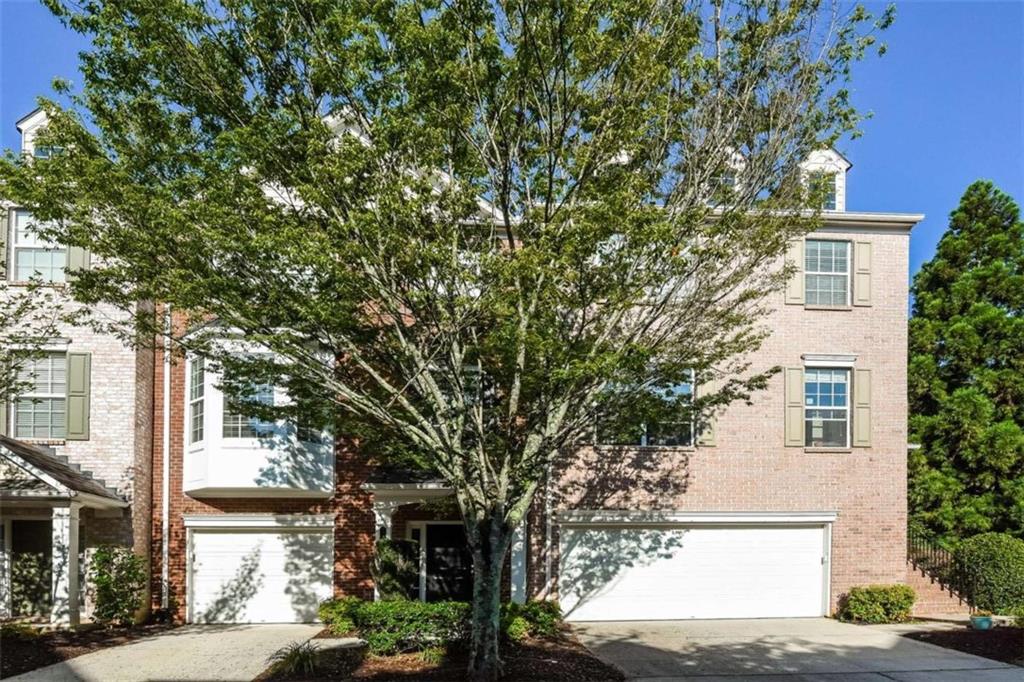 Impeccably cared for 4BR/3.5BA townhome in the highly desirable Wellsley subdivision of Johns Creek, known for top-rated schools. This spacious 3-level home offers fresh interior paint and upgraded LVP flooring throughout. The kitchen features sleek stainless steel appliances and an electric range, perfect for everyday cooking. The expansive primary suite includes a tray ceiling, generous walk-in closet, and a spa-like bath with double vanity, soaking tub, and separate shower. Relax or entertain on the private back deck with peaceful green space views. The finished terrace level includes a full bedroom and bath-ideal for guests, a home office, or fitness area. Close to shopping, dining, parks, and more.