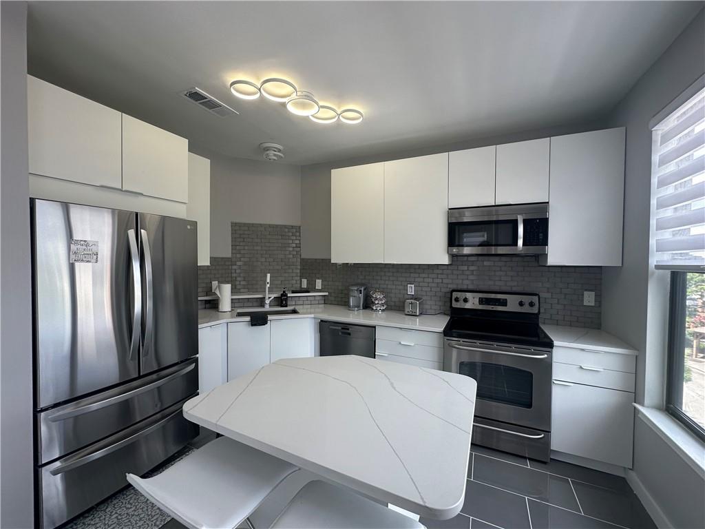 Bright, modern condo just steps from The Beltline, Lee + White, and major interstates—plus right next to the upcoming West End Mall development. Features quartz countertops, Bosch dishwasher, double French door fridge, Jacuzzi tub, electric fireplace, and private balcony. Recent updates include new lighting, fixtures, and plumbing. Move-in ready in one of Atlanta’s fastest-growing areas