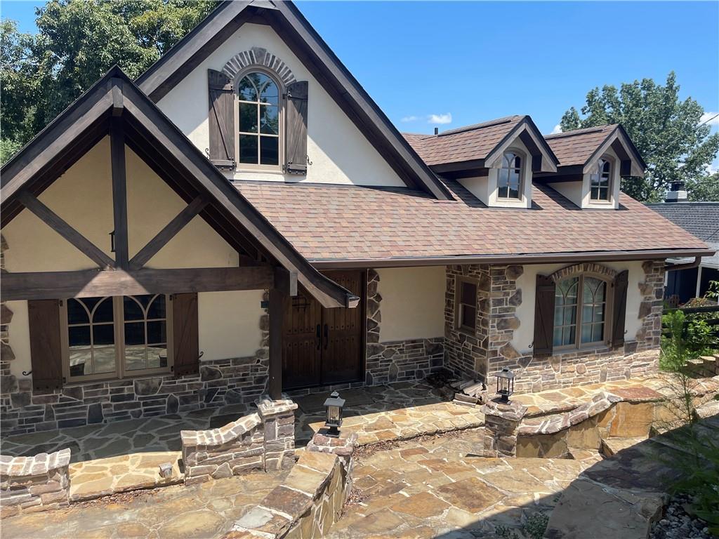 Available for showings after 7/1/2025 Adorable lakeside retreat on the beautiful Lake Lanier.This home is updated from top to bottom with hardwood floors, new cabinets, granite countertops and an open floor plan. Main level boasts two bedrooms with a shared bath. Basement features the private owners suite. Outside you will enjoy multilevel decks and a fantastic lake view with your own private single slip dock. Owner Managed property. Easy application process from start to finish! 1 or 2 year lease available.