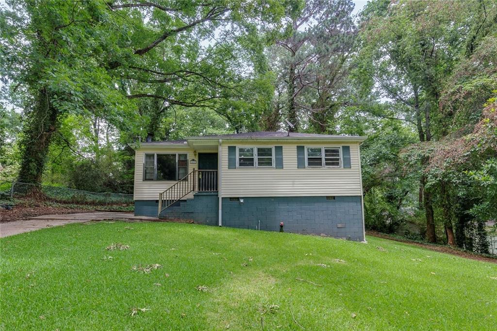 Opportunity knocks with this classic 2-bedroom, 1-bath home nestled on a spacious, level lot and a screened in patio! Built in 1961, this single-story gem offers solid bones and vintage character, ready for your personal touch and updates. Inside, you'll find original hardwood floors on the main level and a cozy layout filled with natural light. A bonus third room currently used for laundry presents the perfect chance to create a third bedroom, office, or flex space.
Ideal for investors, first-time buyers, or anyone looking to build sweat equity, this property needs work but offers endless potential. The expansive backyard provides room to garden, expand, or simply enjoy peaceful outdoor living. Whether you're looking to renovate or reimagine, this home is full of possibilities. Don’t miss your chance to make it your own!