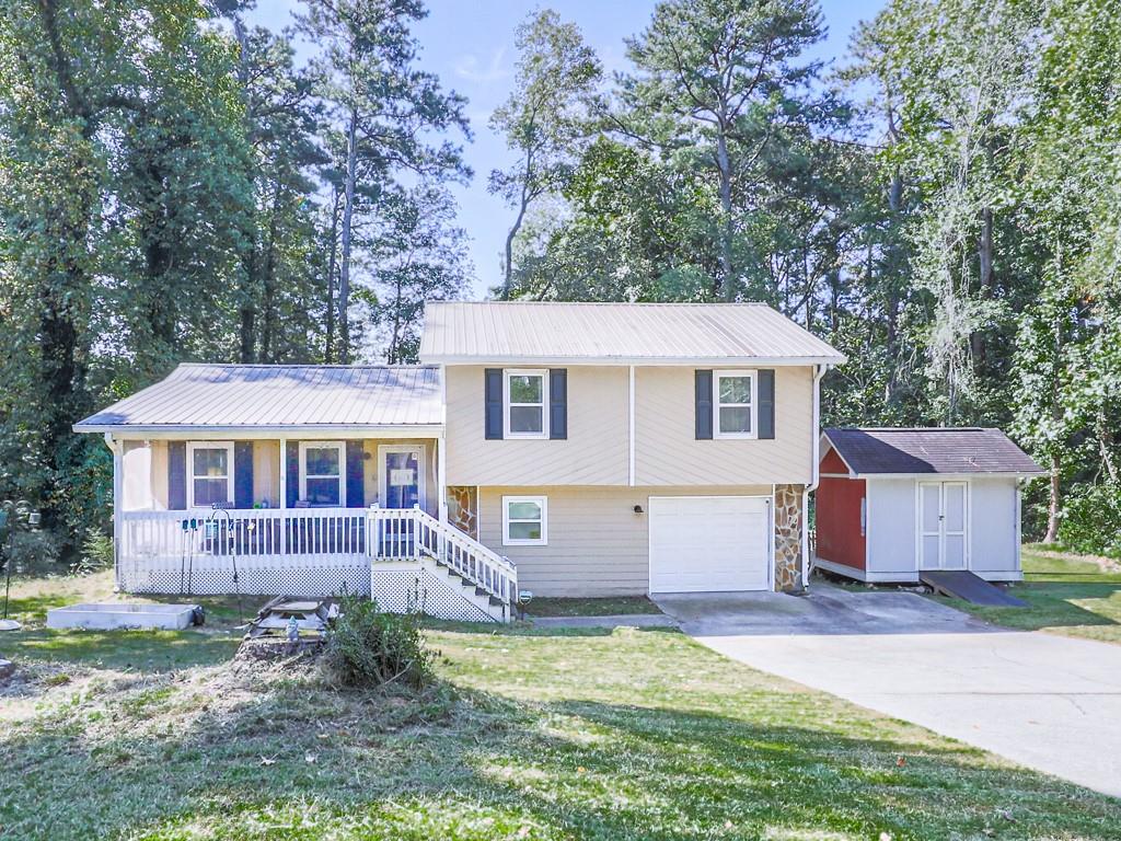 Welcome to your home! Perfectly situated on a quiet cul-de-sac with no HOA, this home offers privacy, freedom, and convenience—just 10 minutes from The Avenue, less than 5 minutes from Hiram, and only a mile from scenic hiking and running trails.
Featuring 3 bedrooms and 2 bathrooms upstairs, plus an additional bedroom or bonus room and an oversized laundry room, this layout offers both comfort and flexibility. A cozy family room adds to the charm, and LVP flooring flows seamlessly throughout the entire house for a modern, low-maintenance touch.
The kitchen boasts granite countertops, crisp white cabinetry, and a dining area ideal for everyday meals or hosting guests. Outdoors, enjoy a large fenced-in backyard with a covered patio and open sundeck, plus a welcoming front porch—perfect for relaxing or greeting neighbors.