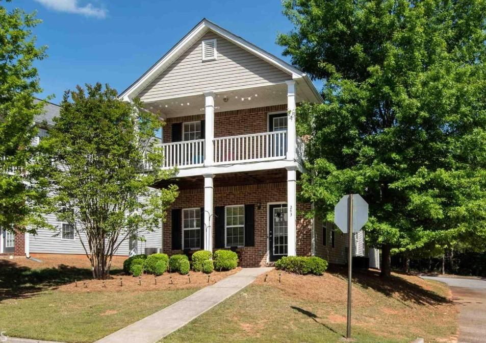Fantastic Charleston-style house with an inviting front porch. You walk into a spacious great room with a wood-burning fireplace. The kitchen features ample cabinet space, stainless steel appliances, and a large pantry. The owner's suite on the main floor includes two closets, and the owner's bath includes double vanities with a soaking tub and shower. LVP flooring throughout the main level. Rear entry garage with hallway leading to the washer/dryer combo (Washer/dryer stays). Upstairs contains two oversized secondary bedrooms. The front bedroom unit provides access to a relaxing covered porch. Jack and Jill style bathroom with separate vanities and walk-in closets. Conveniently located near schools, shopping, UGA, and entertainment. **Brand new roof just installed August 25, 2025!** Agent owned. Tenant Occupied.