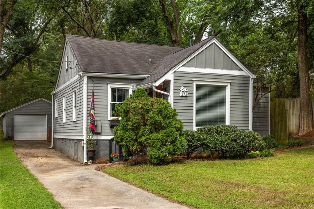 Full of charm and just blocks from East Atlanta Village, this bungalow is basically your Pinterest board come to life. This 2-bed, 2-bath gem is zoned for highly rated Burgess-Peterson Academy, so you can enjoy one of the best elementary schools in the area while being moments from EAV’s coffee shops, dining, boutiques, and nightlife. Inside, gleaming hardwood floors, graceful arches, and perfectly preserved dental molding tell the story of a home with true character. The thoughtful layout tucks both bedrooms—with full bath access—privately away from the main living spaces, giving you the best of both comfort and function. The garage is ready for whatever you need—parking, storage, or that dream home gym. Out back, it’s pure magic: a fully fenced yard with a newly stained deck for al fresco dinners, a cozy fire pit for chilly nights, and a lush garden that’ll make you forget you’re in the city. From weekday coffee runs to weekend backyard hangs, this home delivers the very best of EAV living in one perfect package.