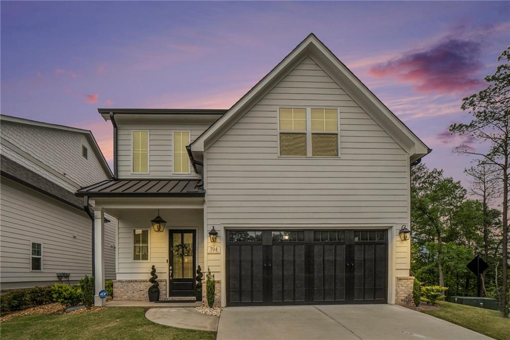 Gorgeous executive home. Pristine and shows like a model home. Just minutes to The Marietta Square with great restaurants, entertainment and festivals. Bright white kitchen with quartz countertops, stainless steel appliances, gas cooking, upgraded tile backsplash, built-in microwave, recessed lighting, Island and breakfast bar. Large great room with marble gas log fireplace, built-in shelving and French doors that lead to the private backyard. An open concept dining room can seat up to 10. Spacious master bedroom on the main with double tray ceiling and private bathroom featuring granite double vanity countertops, tiled flooring, oversized upgraded tile shower and walk-in closet. Large secondary bedrooms with great closet space. Spacious loft area that works great for a home office. Upgraded hardwood flooring on both upstairs and downstairs. Ten-foot ceilings on the main level and nine-foot ceilings on the second level. Professionally landscaped yard. The hoa takes care of the lawn maintenance. Peaceful, private fenced in backyard with covered patio perfect for a cooking out. Sq. feet is 2,550. This neighborhood is next to the Marietta City Gold course. Great location to the Marietta Square, great shopping, restaurants, entertainment, I-75, 285 and the Airport.