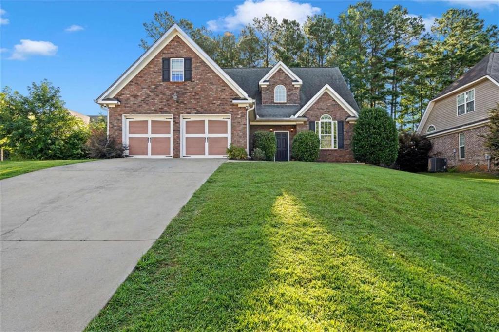 Welcome to this beautiful two story home, thoughtfully designed with modern comforts and stylish finishes throughout. The kitchen and bathrooms are adorned with elegant granite countertops, complemented by rich hardwood flooring that flows seamlessly through the main living areas. Stainless steel appliances and contemporary paint tones create a sleek, inviting atmosphere perfect for everyday living and entertaining. Upstairs, a spacious bonus room offers incredible flexibility-ideal for a fourth bedroom, home office, media room, or playroom to suit your lifestyle needs. Cozy up by the fireplace on cool evenings, or spend sunny afternoons unwinding by the community pool in the desirable Magnolia neighborhood. This home offers the perfect blend of functionality, style, and community charm-don't miss your chance to make it yours! This home is total electric! Zoned in the award winning BREMEN CITY SCHOOL SYSTEM! Be sure to also check out the private HOA pool! To get to it use 100 Club Drive, Bremen and it'll take you straight to it.