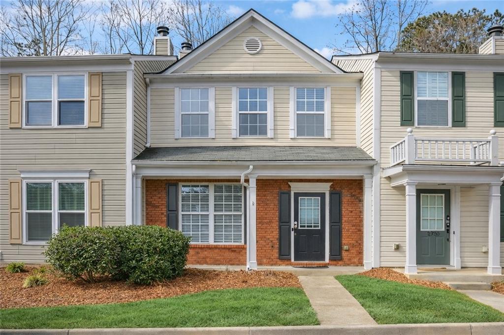 Traditional home with brick siding