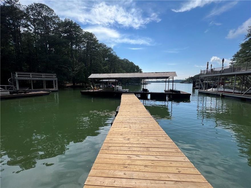 Discover the perfect opportunity to build your dream lake retreat at 812 Willow Oak Drive, Lot #15 — a beautiful and buildable lot with a rare deeded boat slip on Lake Allatoona! Nestled in a quiet, established community, this gently sloping property offers privacy, convenience, and direct access to one of North Georgia’s most sought-after lakes. The lot features a natural wooded setting and a level building site ideal for a basement or ranch-style home. Simply cross the street and follow a short wooded path to your own covered dock slip, where you can spend weekends boating, fishing, or relaxing on the water. Enjoy the serenity of the forest canopy while still being just minutes from marinas, parks, and all the outdoor recreation Lake Allatoona is known for. With easy access to I-75, Canton, and Cartersville, this location combines lakeside tranquility with convenience. Whether you’re envisioning a full-time residence or the perfect weekend getaway, this property offers a rare chance to build your custom home and enjoy lake life all year long. Don’t miss this incredible opportunity—lots with deeded dock access on Lake Allatoona are truly hard to find!
