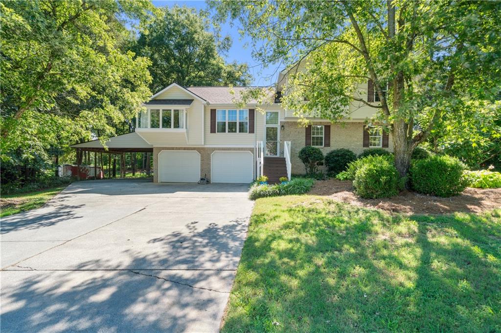 Nestled on a spacious 0.60-acre lot in Calhoun, this tri-level residence at 193 Farmington Drive offers both comfort and versatility, with no homeowners association restrictions. With four bedrooms and three bathrooms spread across 2306 square feet, this home provides ample space for varied living arrangements. The property is graced by mature hardwoods and vibrant perennials, creating a serene and inviting exterior that truly comes alive during the summer months.
Upon entering, guests will discover a thoughtfully designed layout that balances shared living areas with private retreats. The main level hosts a welcoming living space, ideal for gatherings and relaxation. Adjacent to this, the dining area, featuring a bay window, offers a pleasant setting for meals, allowing natural light to stream in and views of the surrounding greenery to be enjoyed. The kitchen, updated with new countertops in 2024, is equipped to handle culinary endeavors with ease. Its functional design ensures a smooth experience for those who enjoy cooking and entertaining.
The upper level of the home is dedicated to three bedrooms and two bathrooms, including the main primary suite. This expansive suite offers a private sanctuary with its custom-built bed frame and integrated cabinetry, which will remain with the home. The en-suite bathroom provides a separate tub and shower. A second bedroom and bathroom on this level offer additional comfortable accommodations, perfect for guests or a home office.
The lower level introduces a unique and highly functional space. It features a second primary bedroom with an accessible bathroom, designed for ease of use. This level also includes a convenient kitchenette, providing independence and privacy for extended guests or a separate living area. A bonus room on this level offers flexible space that can be adapted to various needs, from a recreational area to a dedicated hobby room. For added convenience, an electric stair lift from the garage provides effortless access to the main level, enhancing the home's accessibility.
Outdoors, the property continues to impress with its fenced backyard, providing a secure and private environment. This area is a true highlight during the summer, offering ample space for outdoor activities. A firepit creates a perfect spot for evening relaxation and marshmallow roasting under the stars, while a dedicated garden area invites green thumbs to cultivate their favorite plants. The home is also wired for a Goal Zero Yeti backup power source, offering peace of mind during unforeseen outages.
This Calhoun residence provides a blend of comfort, adaptability, and thoughtful features, making it an appealing option for those seeking a well-appointed property in a desirable location without the constraints of an HOA. The attention to detail, from the updated kitchen to the accessible lower level and robust outdoor amenities, ensures a living experience that is both enjoyable and practical.
To learn more about this exceptional property and to arrange a private viewing, please contact Jenny Smith & Associates.