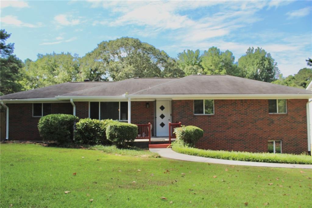 Charming 4-sided brick ranch in the Brookwood school cluster! This 3 bed, 2 bath home sits on a spacious, level lot with a fenced backyard and covered patio. Features include hardwood floors, separate dining room, eat-in kitchen, and 2-car carport. Conveniently located near Hwy 78, parks, shopping, and dining. Don’t miss this well-maintained home with great potential!