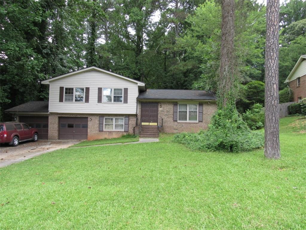 Amazing Opportunity tucked away in small quiet subdivision. Investor special!! 3BR/2.5BA brick and frame split level home. Location is great for access to the Silver Comet Trail, parks, recreation, The Battery, shopping , dining, medical facilities, E/W connector, expressway and more. Home does need total renovation! Main level offers foyer, formal living room with fireplace, kitchen and formal dining room. Downstairs you will find a nice size den(could be possible 4th bedroom), laundry room and 1/2 bath. All 3 bedrooms and 2 baths are located on upper level. Nice level yard ready for new landscaping and add your fire pit for a nice outdoor retreat. Property sold As Is.