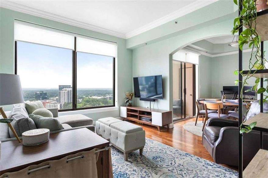 Enjoy Luxury living in one of Buckhead's Finest Highrise buildings with the Stunning Western Sunset Views from  the 31st floor in the Paramount At Buckhead ! This Stunning 1 bed/1 bath condo is perfect for entertaining with  views in every room ! The Spacious kitchen with stainless steel appliances, granite countertops, double sink, staingrade cabinets and a breakfast bar. The light, bright living room features hardwood floor, crown molding, built-in  shelving and dramatic floor to ceiling windows with gorgeous views of the city, a large balcony and storage closet!  This beautiful condo also features a large romantic master suite with carpets featuring a ceiling fan, crown  molding and a spa bath with granite countertops, tile floor and shower/tub and huge walk-in california closet! This  unit is unique as it comes with a GARAGE! . Step outside of Paramount, and you're in the heart of it all. Treat  yourself to a nice massage at the Waldorf Astoria next door , easy access to MARTA to go in to town or airport,  enjoy the delights of award-winning restaurant such as NOBU, ARIA, LITTLE ALLEY STEAKHOUSE, MAGGIANO'S,  or indulge in retail therapy at Lenox and Phipps Malls. You are in close proximity to I-75, I-85, I-400 and within 15  mins to the airport. The Paramount has a unique short cut behind the building to escape all of the busy traffic on  Peachtree and directly goes to Lenox to 400!!