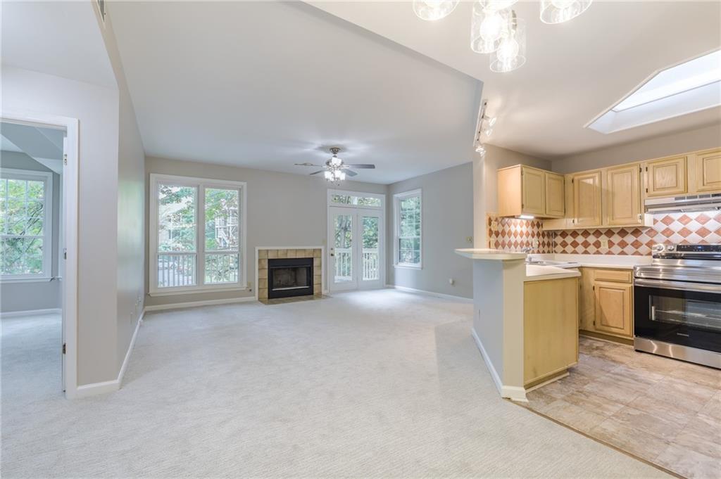 This lovely one bedroom condo in downtown’s idyilic McGill Park has fresh paint and new carpeting throughout the unit. An open-concept plan leaves the main living areas soaked in sunlight, including the living room with fireplace, dining area + kitchen with brand new stainless appliances and a tile backsplash. The unit’s bedroom is well-sized with a pass-through closet with direct access to the bathroom, featuring tile tub surround. There’s a large patio and storage closet, too. This beautiful community is full of mature trees and amenities including pool, gym + EV chargers.