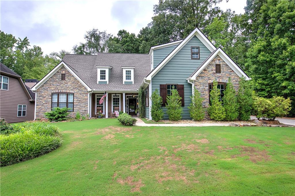 This is THE ONE!!! Hard to find step less ranch. The largest ranch floor plan offered in the Sedgefield Community on one of the largest lots! This 3 bedroom 2 bath home sits on a little over an acre of land with excellent privacy and fenced in backyard. An entertainers delight with open floor plan, eat - in kitchen, keeping room, spacious family room and sunroom. Hardwood floors throughout the entire main living space. Kitchen includes granite countertops, tile backsplash, keeping room and opens to incredible sunroom, boasting natural light and views to private back yard, screened porch, large deck and outside living space/gazebo. Large master bedroom with sitting area and his/her closets. Desirable split bedroom floor plan with spacious side entry garage. Large master bathroom with tile floors and double vanity. Great outside space with gazebo and fireplace allows for the perfect outside spot to listen to the creek or host a BBQ. Huge floored attic for storage as well. COMMUNITY POOL. Close to shopping, schools and entertainment. Don't miss out on this one!!