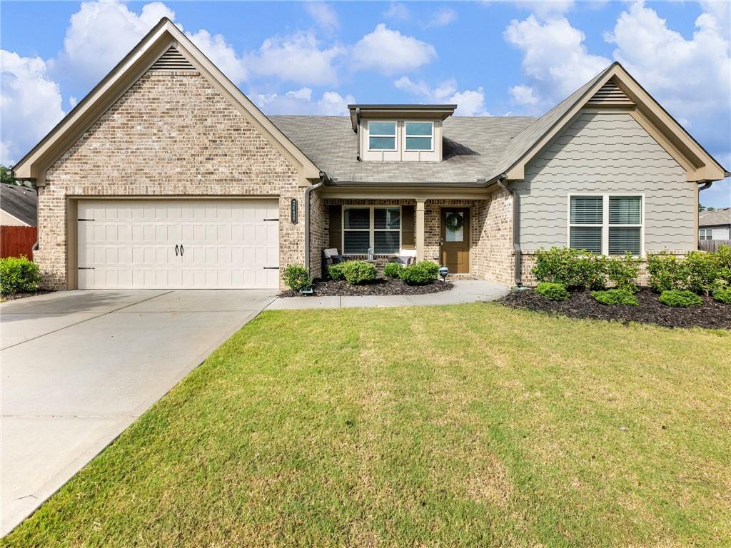 Best Lot in the Neighborhood: Has the most space in between all other homes! Beautifully maintained ranch with oversized master bedroom, 2 guest rooms, plus a Bonus bed room upstairs! Gorgeous stone countertops in open concept kitchen that overlooks family room with high spacious ceilings! View from windows look out to private, fully fenced large back yard, which features covered patio, fire pit area, playground, and vegetable garden that is ready for next season's harvest! Subdivision is small and quiet with only a handful of homes! Within walking distance across the street from high school, middle school, and wooded walking trails! All this conveniently located less than a mile from I-85, and within a short drive to shopping and restaurants by Mall of GA.