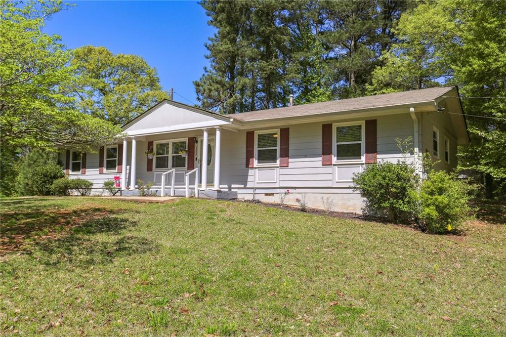 This charming ranch on an expansive corner lot in the highly-desired North Cobb school district is the perfect place for you! This one-level home has been fully updated with new custom cabinets, granite countertops, prepping island, and farmhouse sink in the kitchen, as well as a grand eating area open to the family room. The master bathroom has been beautifully renovated, and new LVP flooring can be found throughout the home.The exterior boasts a lush landscaped yard, cheerful rocking chair front porch, and private fully-fenced backyard. The crawlspace has a new vapor barrier installed to ensure insulation and prevent external moisture. This stunning home is conveniently located minutes from KSU and West 22 and is perfect for entertaining family and friends.