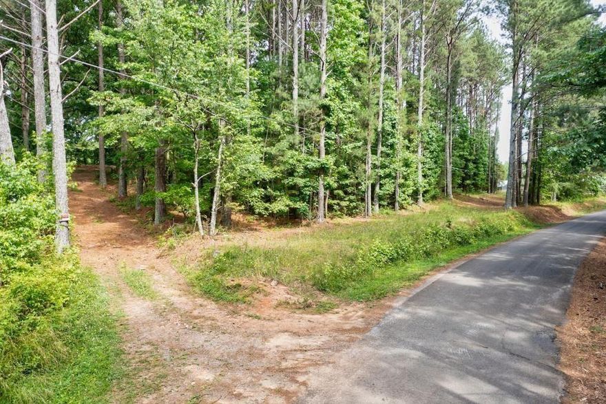 Welcome to 1251 Old Jones Road! Are you looking for space? You will find it in this stunning estate lot on ~ 9.782 acres in beautiful Cherokee County. Wooded hilltop homesite surrounded by granddaddy oaks and a lake view. Additionally, there are two streams on the property.  Privacy, quiet, beauty and tranquility are what you are buying in this lot. You are only a stones through away from Milton but with the benefits of Cherokee County taxes and an Alpharetta address. Just a few minutes drive to the fabulous 7 Acres BarNGrill and Publix shopping center. There is ~ 400' of paved road frontage with utilities available to the property. Come see 1251 Old Jones Road today, you will not be disappointed!