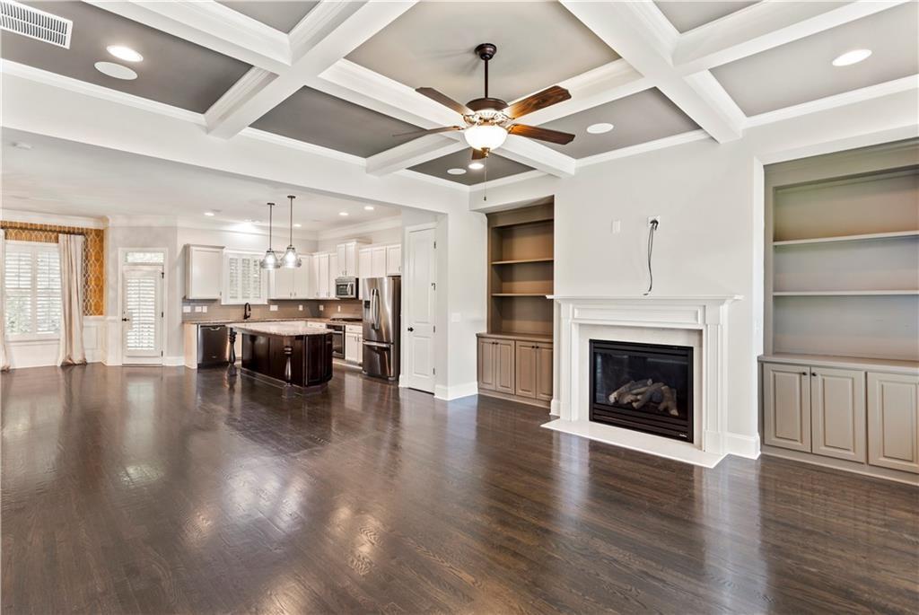 Great value for this beautiful home located in the affluent Buckhead neighborhood. Whether you are a corporate relocation or a local looking for a move-in ready rental, this could be the home for you. This beautiful home is located off a quiet street in a small enclave of detached homes with a maintenance free lifestyle. Whether you like an active lifestyle, a foodie, or just like to shop and enjoy the arts, this home has the perfect location. Conveniently located near parks, trails, five star restaurants, high-end world class shopping at Phipps Plaza, Lenox Square and Buckhead Village. Near the International School, Minutes to Emory Hospital, Children's Healthcare of Atlanta, Piedmont Hospital, Sheperds Center, a quick drive to Buckhead, Midtown and Downtown Financial Center, Coca Cola,Google, Microsoft, Hawks training Camp and more...This home boasts an open-concept floor-plan with views of the living room and dining room from the kitchen.The main floor offers 10ft ceiling, spacious living room with coffered ceiling, surround sound throughout, hardwood floors, gas fireplace, bookshelves, Juliet balconies, Kitchen with over-sized island, granite countertops, pantry and lots of storage. Spacious separate dining room with easy access to kitchen and deck. Spacious master bedroom with private wooded view, Owners bath comes with double vanities and separate tub/shower and large custom closet. Lower level includes a perfect in-law suite along with an additional office or flex space. Surround sound throughout. Easy access to GA 400 and I85 and access road to midtown. H.O.A is responsible for landscaping. Move-in ready.