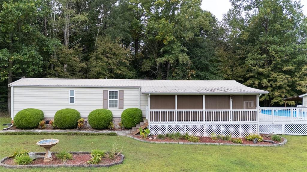 Looking for a property that provides value, beautiful country views, great landscaping, and very absolutely well taken care of?!?!? 253 Mountain Oak Drive in Murray County is the property. This well maintained property has several outbuildings, plenty of parking, an above ground pool, and a beautiful front porch with shutters installed and a GREAT setting for your morning coffee. Schedule your viewing today to view this great property before it goes quick! Send your offers because these seller are ready to SELL, SELL, SELL. Property is sold "AS-IS"