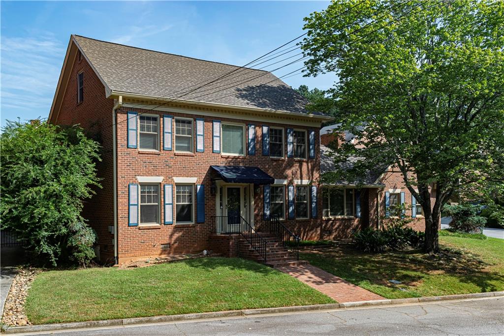 This spacious 4-sided Brick, 2-1/2 story home is move-in ready. Conveniently located off Chamblee-Tucker Road near I-285. This home features a large living and dining area, main level bedroom with full bath, a recently-updated kitchen with stainless steel appliances and quartz counters. The additional family room with cathedral ceiling and gas log fireplace completes the main floor. The second floor has two large secondary bedrooms served by a full bath and an oversized primary bedroom with an updated ensuite bath, plus walk-in closet. The third floor is a fully-finished bonus room ready for use as a playroom or media room. The home sits on a corner lot at the back of this quiet community and features a trellis-covered patio off the family room for quiet evening enjoyment. There is a 2-car attached garage. Great schools. Easy access to shopping and restaurants.