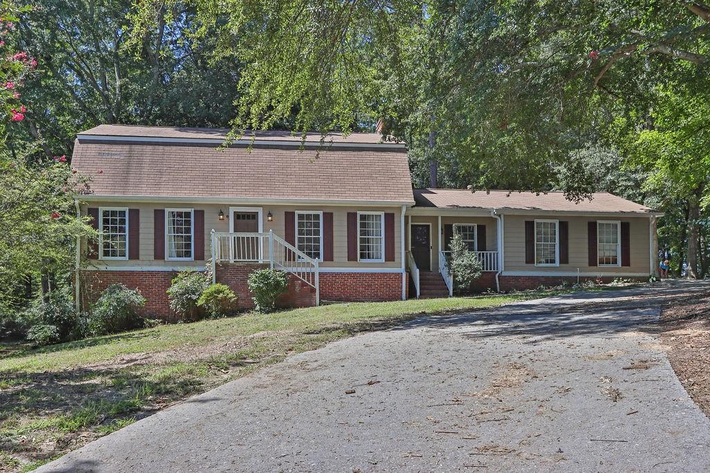 Charming Stone Mountain Home on a Cul-de-Sacb Welcome to this spacious 4-bedroom, 3-bathroom home located on a quiet cul-de-sac in Stone Mountain. Sitting on a level lot with a large backyard, this home offers both functionality and flexibility for today's lifestyle. Inside, you'll find a well-designed floor plan featuring a double-sided fireplace connecting the family room and breakfast area, creating a warm and inviting atmosphere. A separate dining room comfortably seats 10, perfect for entertaining. The formal living room offers flexibility to be used as a home office or additional TV room. The main level includes one bedroom and a full bathroom, ideal for guests or multi-generational living. Upstairs, the oversized primary suite boasts a spa-like bathroom with double vanity and soaking tub. Two additional generously sized bedrooms and a full bath complete the upper level.The home also includes a partially finished basement, offering additional living space or storage potential Other highlights include: No HOA No rental restrictions Septic system serviced in 2024 This home blends comfort, space, and convenience-perfect for homeowners or investors alike.