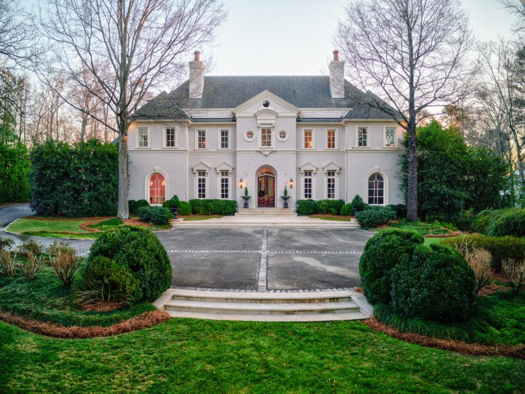 Elegant custom estate home sits on 2 tranquil acres. Large foyer flanked by cozy paneled library & bar leads to light-filled great room w/wall of French doors offering beautiful entertaining and family spaces. Exceptional kitchen renovation in 2017 opens to bright keeping room & brkfst room. Master on main w/luxurious bath & custom his/her walk-in closets. Upstairs are 4 ensuite bedrooms, sep den & bonus rm. Stone terraces overlook pool, gazebo and lush flat lawn w/putting green. Oversized terrace level features full 2nd kitchen, family room, full bed/bath, gym & more.