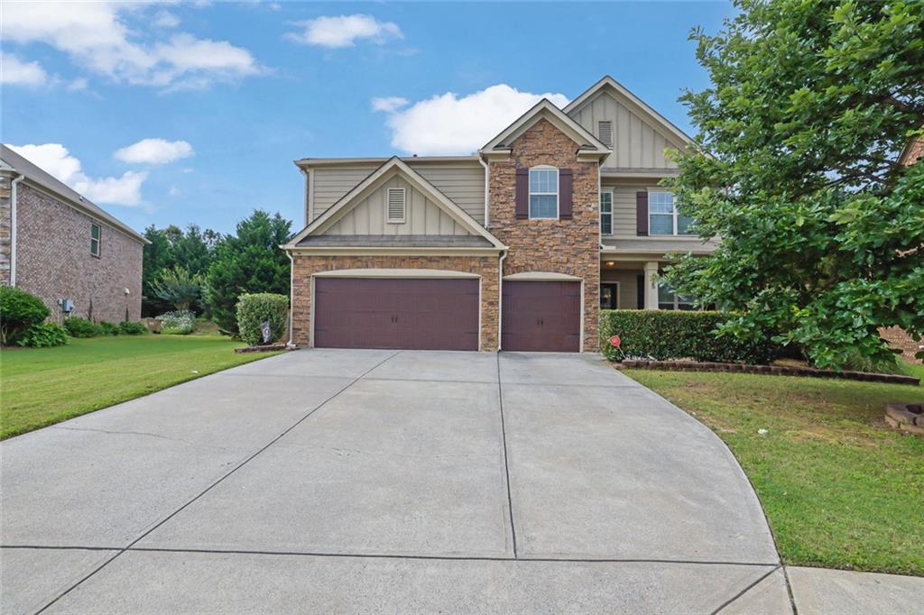 Welcome to 425 Eldridge Dr, a beautifully maintained 3-sided brick home nestled in the highly sought-after Nichols View subdivision of Suwanee! This spacious 5-bedroom, 4 full bathroom residence with a 3-car garage blends timeless curb appeal with modern comfort, all within one of Forsyth County’s top-rated communities. Step inside to an inviting open-concept layout featuring LVP flooring throughout the main level. The gourmet kitchen is the heart of the home, offering clear sight lines into the family room, living room, and elegant dining area with coffered ceilings. A center island, gas range, and stylish tile backsplash make this kitchen ideal for cooking, entertaining, and everyday living. A guest bedroom and full bath on the main floor offer flexibility for visitors or multi-generational families. Upstairs offers four generously sized bedrooms, two versatile lofts—ideal for a media room, office, or playroom—and an oversized primary suite featuring a tray ceiling, private sitting room or nursery, and his-and-her walk-in closets. The spa-inspired primary bathroom features a dual vanity, soaking tub, and separate walk-in shower. Step outside to a backyard built for relaxation and fun. Enjoy evenings on the extended patio next to the outdoor brick fireplace, while children or pets play safely in the private fenced-in yard. Best of all, this home is within walking distance to the community pool and playground, offering an active lifestyle just steps from your door. Located near top-rated schools—including Lambert High, Riverwatch Middle, and Settles Bridge Elementary—plus easy access to parks, shopping, and dining, this home truly has it all. Don’t miss your chance to own this rare gem in one of Suwanee’s premier communities. Schedule your showing today! Discounted rate options and no lender fee future refinancing may be available for qualified buyers of this home.