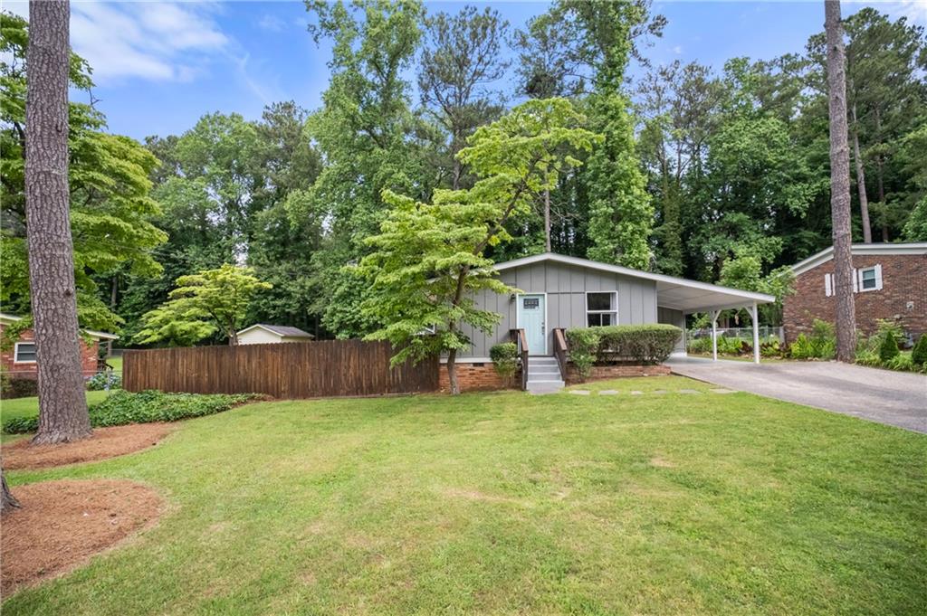 Welcome Home! Beautifully updated home in a superior location. Quick access to highways, Truist Park & The Battery, shopping and dining. 3 bedrooms 2 full bathrooms with a possible fourth bedroom/office. A spacious patio overlooks your fenced in backyard. The backyard also has a large storage shed with a new roof. Plenty of living space inside and out. Updated kitchen with stainless steel appliances including a stackable washer and dryer.