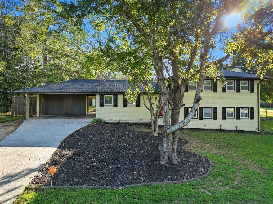 Welcome to instant equity in this beautifully renovated 4-bed, 3-bath split-level traditional home! Every detail has been thoughtfully updated to combine modern luxury with timeless charm. Recent upgrades include all-new plumbing, electrical, roof, and flooring throughout, giving you peace of mind for years to come.
The heart of the home is the entertainer’s kitchen, featuring custom cabinetry, sleek quartz countertops, a large island, and stainless-steel appliances. This open-concept space flows effortlessly into the spacious living area and covered patio, creating the perfect environment for both everyday living and gatherings with family and friends. Upstairs, the Primary Suite is your private retreat with a luxurious ensuite bath complete with a double vanity and a jetted rainfall shower. The secondary bedrooms are generously sized and share a beautifully updated full bath.
The terrace level offers incredible versatility with a private in-law suite, including a bedroom, full bath, and a cozy fireside den/dining area—ideal for guests, multi-generational living, or even rental income. For storage and hobbies, this home features a 2-car carport plus a 24x28 detached finished garage/workshop. The workshop is already wired and finished, making it ready to be transformed into a modern content studio, home office, or additional income-producing space.
Located in a quiet, no-HOA community with low Cobb County taxes, this property not only offers comfort and flexibility but has also been successfully used as a profitable short-term rental investment. Don’t miss this opportunity to own a move-in ready home that truly has it all. Schedule your private showing today!