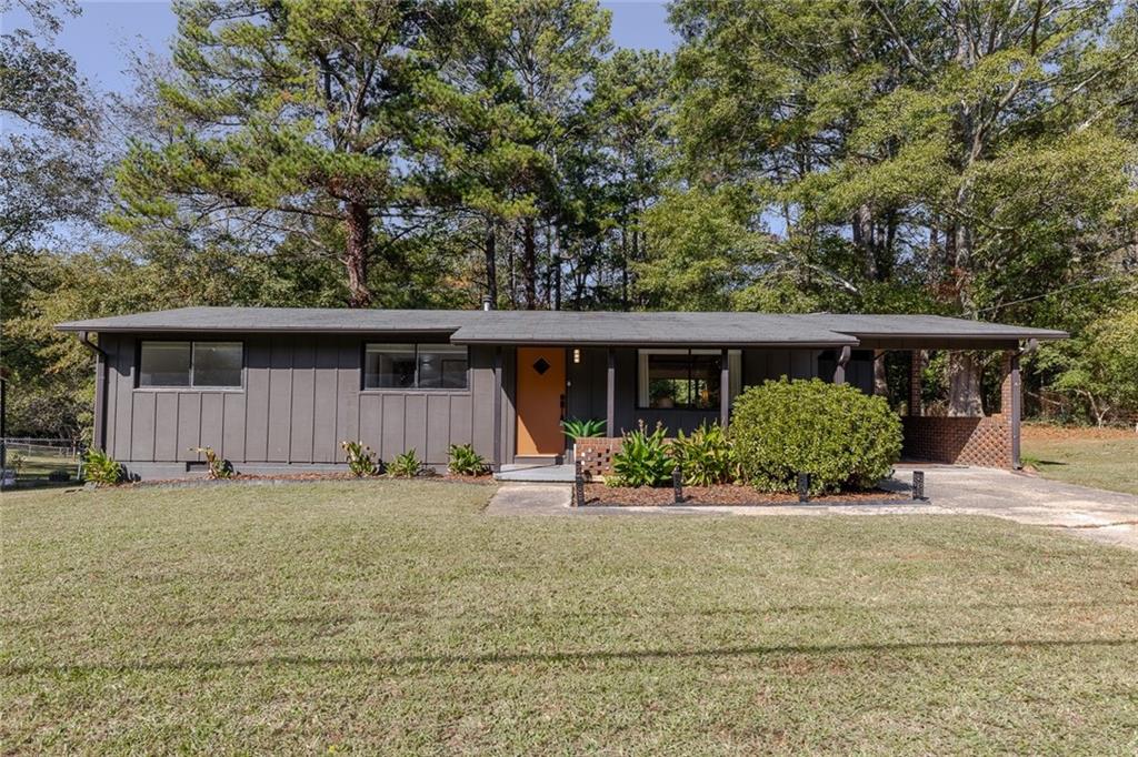 This fully furnished/renovated, modern mid-century ranch is available for short- to mid-term rental, with a minimum stay of 14 days. Perfectly situated just off I-575 and walkable to Downtown Woodstock, this extended stay rental offers convenience and comfort, making it ideal for home sellers between properties or homeowners displaced by insurance claims. All utilities and lawn care are included for a seamless experience. The updated kitchen is equipped with stainless steel appliances and stone countertops, providing a stylish space for meal prep. The bathroom has been recently updated, and the laundry room includes both a washer and dryer for your convenience. The private backyard features a covered area, perfect for relaxing or enjoying an outdoor meal. A $1,000 security deposit is required along with a $200 cleaning fee. This home is managed by an agent/owner, ensuring attentive service and smooth management throughout your stay.