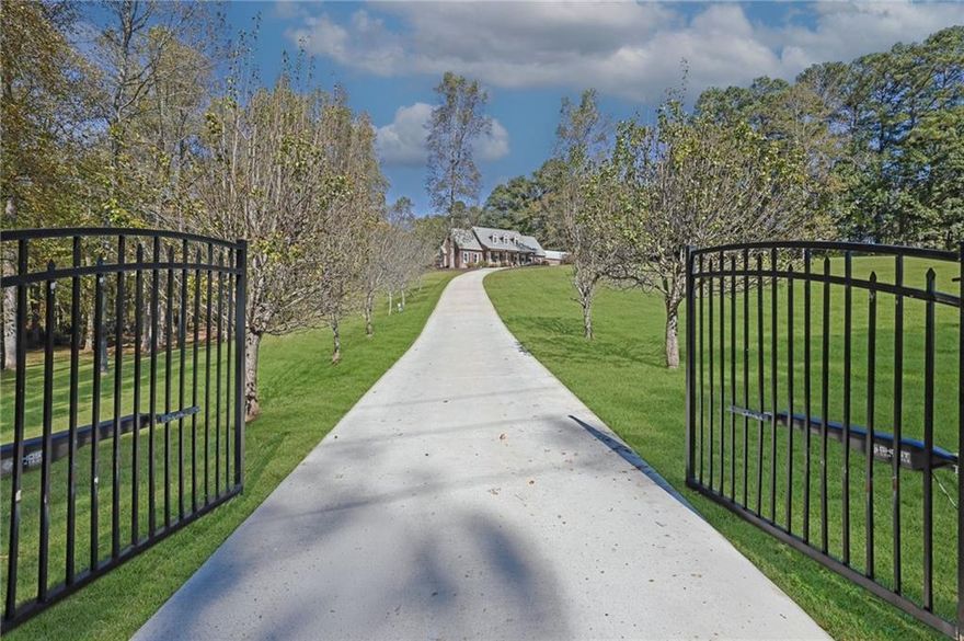 Live the Milton dream!  Expansive estate with classic all-brick ranch-style home surrounded by seven heavenly acres.  Verdant pastures, mature hardwoods, enchanting creeks combine with more than enough land to achieve your equestrian, homesteading and family compound visions.  The main level owner's suite has a sizable bedroom, his & her walk-in closets, oversized shower, custom cabinetry and double vanity. The kitchen has a breakfast nook, granite counters, stainless steel appliances, an oversized island, and two pantries. Upstairs you will find a huge game room, two bedrooms, a bathroom and colossal amounts of closet storage.  The north wing of the house has its own entrance, kitchen, dining area, living room with fireplace, two bedrooms, two baths and a sunroom forming the ultimate suite for in-laws, guests or adult children.  The large metal barn has two garage doors, its own kitchen, a loft, and workshop area.  Three car garage, house and barn are fully fenced in with room for a pool, etc.  With a storm shelter, raised beds for a victory garden, wood burning stoves for backup heat and a productive well for backup water you are prepared for anything life throws at you.  Too many features to list - must see - to appreciate this incredible opportunity.