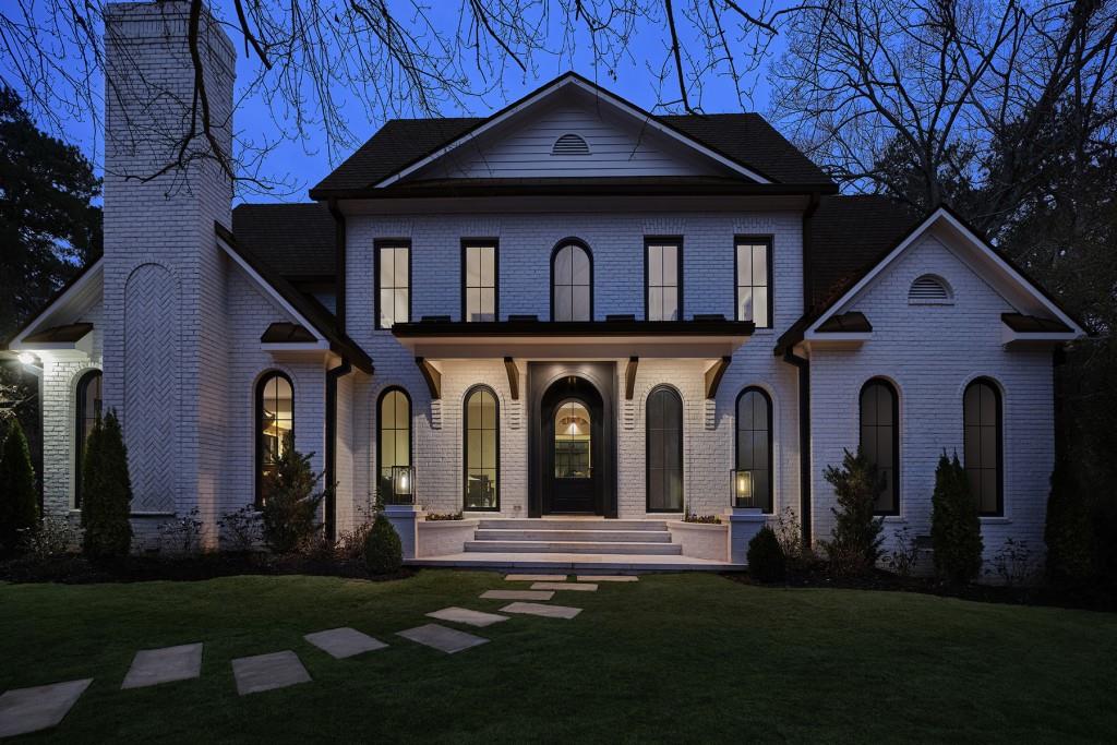 Bespoke Luxury newly reconstructed traditional home (completed 2023) idyllic setting. Eric Rothman designed this Intown Renaissance masterpiece yielding the show-house of the Decatur's spring season. Nestled behind a gated fully fenced estate lot located on the eastern edge of Olmstead's famous Druid Hills Neighborhood. Just steps away from Decatur's vibrant destination entertainment district, this home offers the distinction of Druid Hills with the charm of Decatur Square plus City Schools of Decatur. Newly installed, wide-plank quarter-sawn hardwood floors on all three levels. Metal clad windows custom by JELD-WEN throughout. A grand Hartstone saltwater heated pool with outdoor jacuzzi adjacent to gas-fire feature affording a dramatic focal point from the double story great room. Inside, discover a polished cement, sunken family space showcasing a metal clad modern-chic chimney flanked with custom built-ins housing the massive masonry wood-burning fireplace. The largest full-wall bar includes an ice maker and two massive, refrigerated wine storage columns. Accenting the bar is a 2nd story Juliette balcony. An open-air cat-walk canopies the step-up connecting corridor featuring natural toned pine, tongue and groove ceilings presenting a work of art, hand-crafted 3 story curved stairwell with footstep lighting and industrial-styled metal wainscotting. The informal dining room offers floor to ceiling windows and a 2nd masonry fireplace with decorative gas-lit chimney balls and wide-open to the end-all kitchen. Entertainers will delight in the waterfall marble, free-floating double island. As twin breakfast bars afford massive counter-space, each includes a prep sink and dishwasher. Chef's dream with 2 sub-zero custom cabinet refrigerators and one full size subzero custom cabinet freezer, columns of hidden shelving offer layers of storage. A commercial-grade gas range by Wolfe is flanked by tremendous marble counters extending even into a windowed butler's pantry with hidden overflow refrigerator All 5 bedrooms are en-suite with main floor owner's luxury chambers. The space also offers a movie star's spa-styled bath. Dripping with modern style, the oversized Spa shower has lovely stone-work floors and elegant glass surround. Marble and granite dovetail with elegant warm wood for the floating, double vanity featuring loads of drawer storage and mirrored walls. Chic, free-standing soaking tub is a centerpiece for ultra-cool bath. The owner's walk-in dressing room features a central marble-top island in front of a most terrific, lighted glass shoe-storage wall. Wardrobe space is abundant and the adjacent storage chamber is complete with private washer-dryer. This celebrity suite even features a wood burning masonry fireplace w/ gas starter. Upstairs there is owner's suite #2. With tongue and groove vaulted ceiling + double doors looking over the balcony into the great room, this space could make a handsome men's den with an impressive 2nd luxury bath. Three additional upstairs suites have fantastic, beautiful marble baths with modern accoutrements absolutely on trend for guests. The third floor is a yoga studio and is a delightful play area for active folks of every age. A front office library is the work from home private studio. Opening the double mahogany front doors your guests will know they've arrived as something special. A two car carriage house has a lovely guest cottage above with a kitchenette bath and great room. Pervious pavers create ample parking and flat driveway. Garden stones accent the landscape on 4 sides. This is a lucky find for discerning buyers wishing the finest luxury within the heart of the South's finest small town; a most pedestrian friendly community with a vibrant progressive population + 1 of Atlanta's most awarded k-12 public schools.