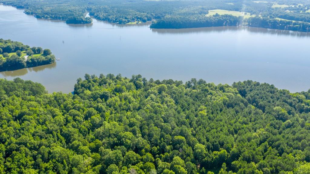 This opportunity to own a mile of deep water frontage on Lake Oconee is unparalleled. Encompassing +/-291 wooded acres, this assemblage offers endless opportunities. Ideal for a family compound on the lake that would have no rival. A previous conceptual for the property called for 127 single family residential lots (32 of those lots were lake front) and included a 58 acre green space. Convenient to shopping, dining, golf, and more. - 1 hour from Atlanta - 12 minutes from I20 exit 121 to property - 10 minutes from Lake Oconee Village - 15 minutes from Ritz Carlton Reynolds