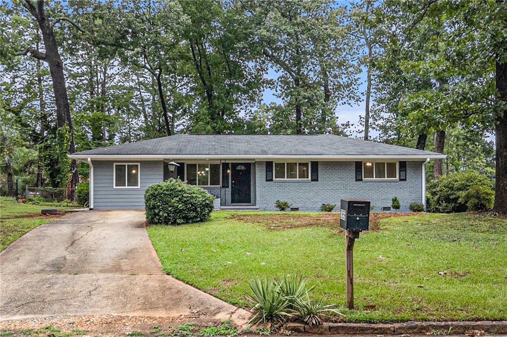 Welcome to 3956 Kirksford Dr, Decatur, GA 30035! This charming 4-bedroom, 2-bathroom home offers incredible value and is move-in ready. New full paint job outside and inside. Fully renovated main bathroom. Some see this renovated and upgraded home, nestled in a peaceful subdivision, it promises tranquility and privacy. Recently installed a new roof and HVAC system, ensuring worry-free living., Freshly painted exterior and interior for a pristine look. Comes with a spacious living area with Hardwood and Tile flooring throughout the home. This home comes with a large front and back yard, great for kids' activities. Ample closets throughout for efficient storage. Updated kitchen boasting new cabinets and majestic granite countertops. Just a short 15-minute drive from downtown Atlanta, combining suburban calm with urban convenience. This home has been completely remodeled, offering peace of mind to its new owners with its updated features and systems. Don't miss out on this opportunity to own a home that blends modern comfort with serene living. Schedule your showing today!