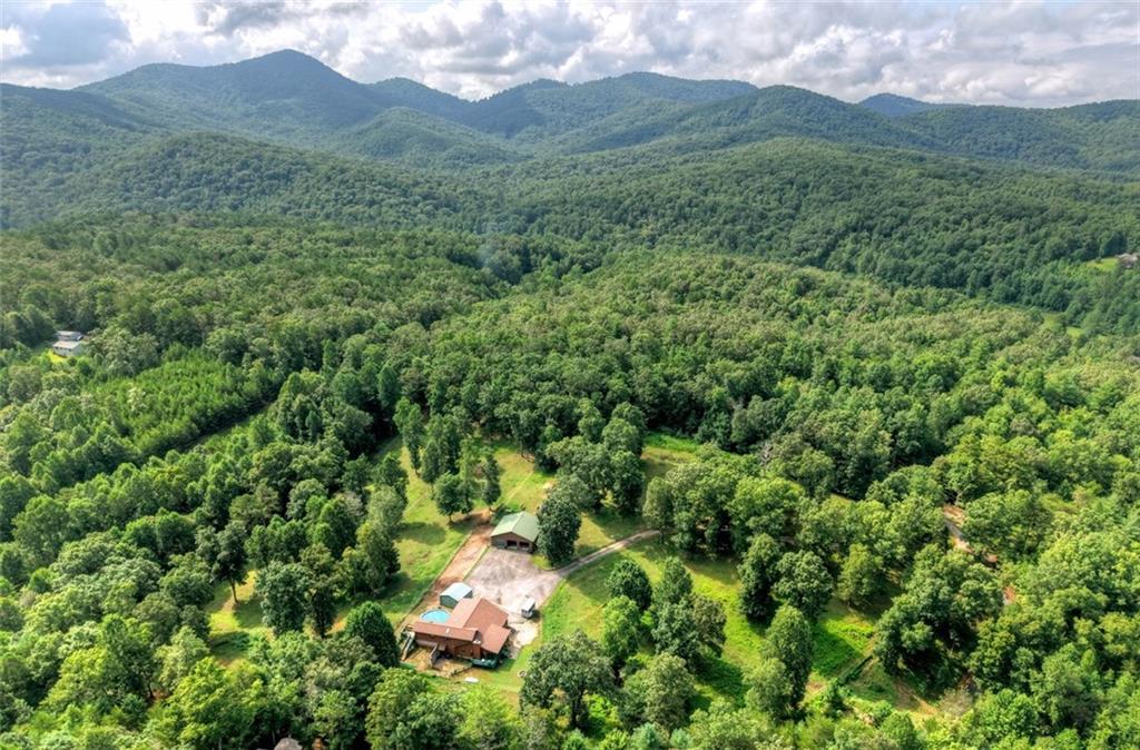 PRICED TO SELL! TRAILS, TRAILS & MORE TRAILS!
Just a mile down a quiet country road, the Chattahoochee National Forest invites you to explore endless hiking, horseback riding, and nature trails.
Welcome to your North Georgia Mountain retreat—9+ picturesque acres of rolling fenced meadows, mountain views, and a charming log cabin home at its heart. The land is fenced and ready for your vision: bring horses, create a hobby farm, plant gardens, or simply savor the wide-open space and fresh mountain air. Privacy and serenity abound here, with outdoor adventure right at your doorstep.
Inside, the cabin blends rustic character with modern comforts. Relax by the stone fireplace, take in sweeping views from the wraparound porch, and let the peaceful sounds of nature melt your stress away.
Whether you dream of an outdoor lifestyle, a weekend getaway, or a full-time mountain escape, this property offers the very best of North Georgia living.
Highlights:
9+ acres of fenced rolling meadows
Direct access to Chattahoochee National Forest trails
Beautiful log cabin with wraparound porch & stone fireplace
Privacy and tranquility, yet close to mountain towns & amenities
Endless opportunities: horses, hobby farm, recreation, or simple relaxation
Don’t miss this rare opportunity to own your slice of mountain paradise—perfect for adventurers, nature lovers, or anyone seeking peace and beauty.
