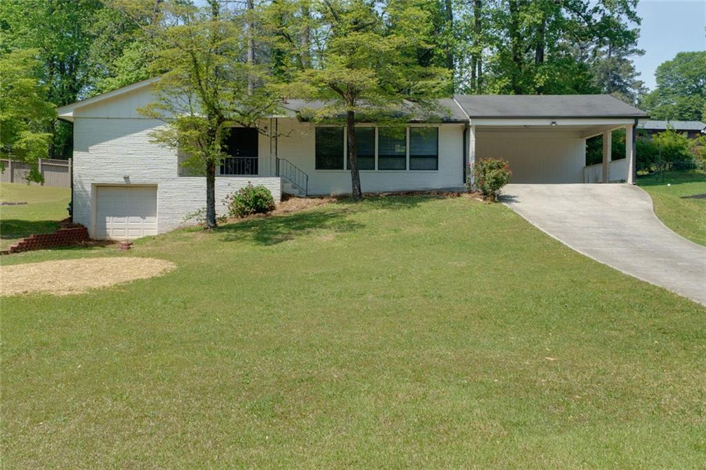 Location Location! Ranch on full basement with a huge lot. Close to I-75 and I-575, and less than 10 minutes to Town Center or Marietta Square! Don't miss this 4 sided brick ranch with updated primary bath, beautiful hardwood floors, versatile full basement with painted walls and a large, level and cleared backyard with overlooking patio! Great community with NO HOA. Come see this one before it gets gone !!