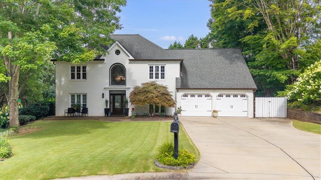 Welcome to this amazing, fully upgraded, top-to-bottom 4-bedroom home with an absolutely impressive lake view from your own private pool and fenced-in backyard! Nestled in a quiet cul-de-sac in the sought-after Chestnut Hill, this stunning renovation is guaranteed to impress even the pickiest buyers! As you approach the house, you’ll love the updated look of the modern white brick and the perfectly manicured landscaping. Walking through the front door, you’ll be greeted by a two-story foyer with gleaming wood floors and a stylish, elegant design. The formal dining room is perfect for hosting your holiday gatherings and parties! The living room features beautiful glass French double doors and is the perfect space for a home office, ensuring the privacy you need for meetings or work calls. The family room, with its beautiful fireplace, is the heart of your new home, and the open concept leading to the stunning kitchen is ideal for entertaining guests. The kitchen features top-of-the-line appliances, an oversized island with quartz countertops, and tons of storage in the custom-built cabinets, all while offering an abundance of natural light and a gorgeous view of your own backyard oasis. This home offers a double staircase with convenient access to the second floor—either through the foyer leading to the oversized primary suite, or from the back staircase off the kitchen with easy access to the guest and secondary bedrooms. The owner’s suite features 12-foot vaulted ceilings, beautiful hardwood floors, and a recently renovated en-suite bathroom with soaring 19-foot ceilings. Relax in the European-style soaking tub and enjoy the beautiful view of a lakeside sunset at the end of a long day. The generously sized secondary bedrooms have newly installed cozy carpet and spacious closets. The guest bathroom features a large stand-up shower and was completely remodeled less than two years ago. Lighting has been updated throughout the house to match the overall modern design, including new recessed lights, fresh interior paint, HVAC systems approximately 4 years old, new front doors, and so much more! Don’t miss out on this home with the best views of Lake Indigo, whether from your backyard or through the gorgeous floor-to-ceiling windows on both levels. This gem, in a very social community, is ideally located near top-rated schools, fine dining, and top-notch restaurants. It's only a 15-minute drive to the highly desirable Downtown Woodstock area, with easy access to interstates and just minutes from I-75 and I-575—ensuring a smooth commute to Atlanta, vibrant city life, and Hartsfield-Jackson International Airport. Chestnut Hill is the place to be when you're looking for convenience and comfort. Feeling social? Step outside your amazing home and enjoy fishing or kayaking on the neighborhood lake, play tennis with friends and neighbors, or join community events by the pool this summer. Schedule your private tour today and fall in love with the best of the best in this subdivision!