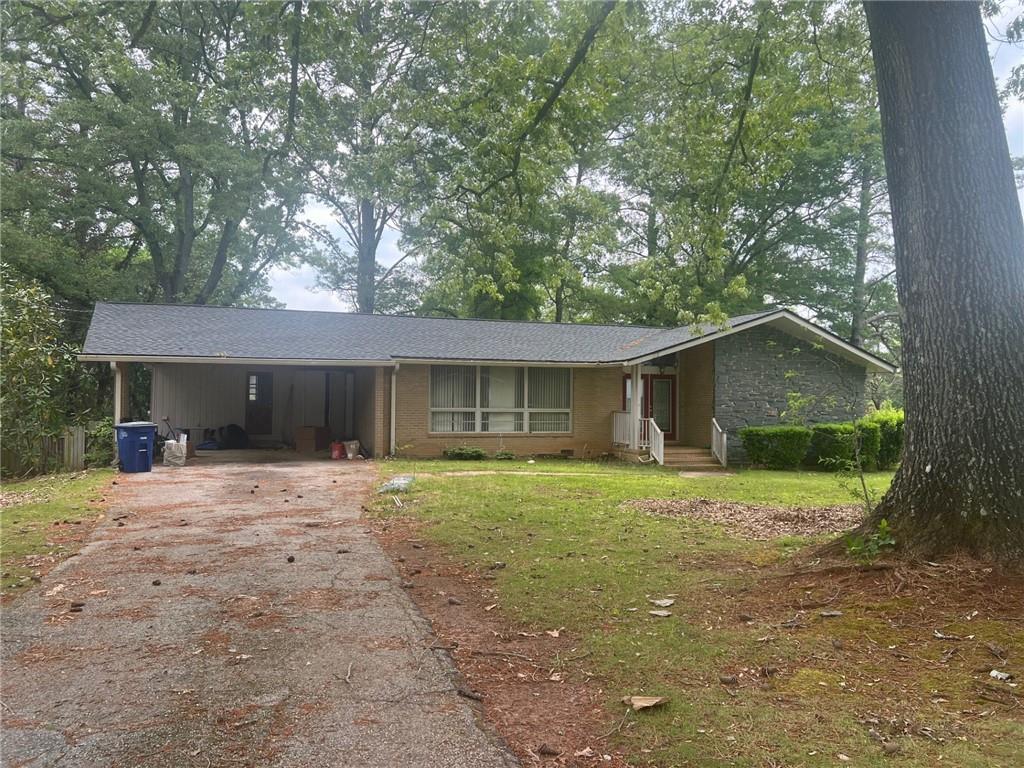 Motivated Seller! Price Reduced for Quick Sale! This charming mid-century home is brimming with potential! Investors or Buyers willing to put in some sweat equity! Featuring a four-sided brick exterior with a striking stone-accented front, it offers 4 spacious bedrooms and 3 baths. Hardwood floors flow throughout, enhancing its timeless appeal. The large family room is bathed in natural sunlight, creating a warm and inviting space. Step out onto the deck and take in the view of the expansive backyard—perfect for relaxation or entertaining. This property sits on a corner lot, that extends outside of the fence area. Plus, full basement, waiting for your personal touch. Great space to provide additional living or recreational space. A true gem waiting to shine! Needs Work! Possible FHA 203k Financing. SOLD AS IS! MOTIVATED SELLER! MUST SEE!