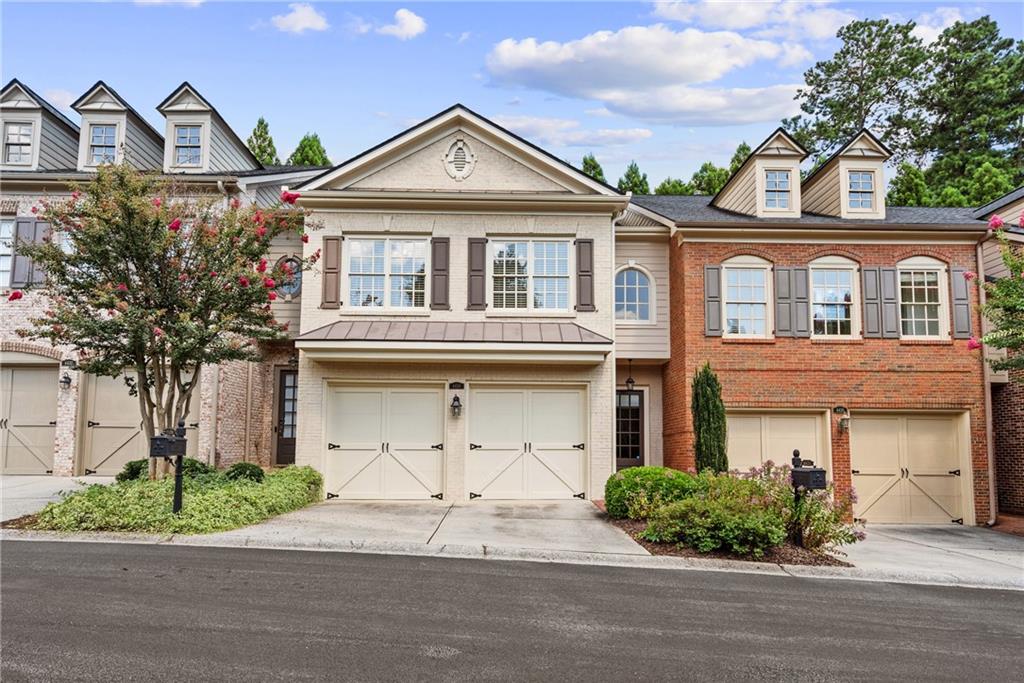Beautiful John Willis townhome in gated Smyrna-Vinings community along the Silver Comet Trail! Close to restaurants like South City Kitchen or the West Village nearby. Neutral painted interior, newer carpet, and gleaming hardwoods throughout main level. Spacious kitchen boasts granite countertops, double ovens, and gas cooktop. New HVAC! Open great room includes gas fireplace and overlooks private courtyard. Oversized master suite with vaulted ceilings, double vanities, walk-in closet and sitting room. Fantastic location just minutes to I-285 and Braves Stadium.