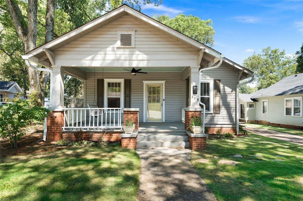 Just Listed – Historic Cartersville Bungalow with Carriage House
Charming 2 bedroom, 1 bath bungalow located in the heart of Historic Cartersville, just a short walk to downtown shopping, dining, and entertainment. The main house features hardwood floors throughout, two fireplaces, a large open kitchen, clawfoot tub, updated wiring, and new gutters.
The property also includes a 1 bedroom, 1 bath carriage house complete with a full kitchen. Perfect for use as an in-law suite, teen retreat, or rental for additional income.
A rare opportunity to own a piece of history with modern updates and flexible living space in a highly sought-after location. Schedule your private showing today!