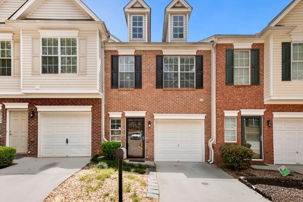 Well-maintained townhome in desirable Avondale Estates featuring a bright kitchen with breakfast bar island, open dining area, and fireside living room. Upstairs offers two spacious bedrooms—each with a private full bath—including a primary suite with vaulted ceilings, double vanities, and a walk-in closet. Enjoy a fenced backyard with a patio, perfect for relaxing or entertaining. Conveniently located near dining, shopping, parks, and major highways. Community allows rentals, making this an excellent investment or personal residence.