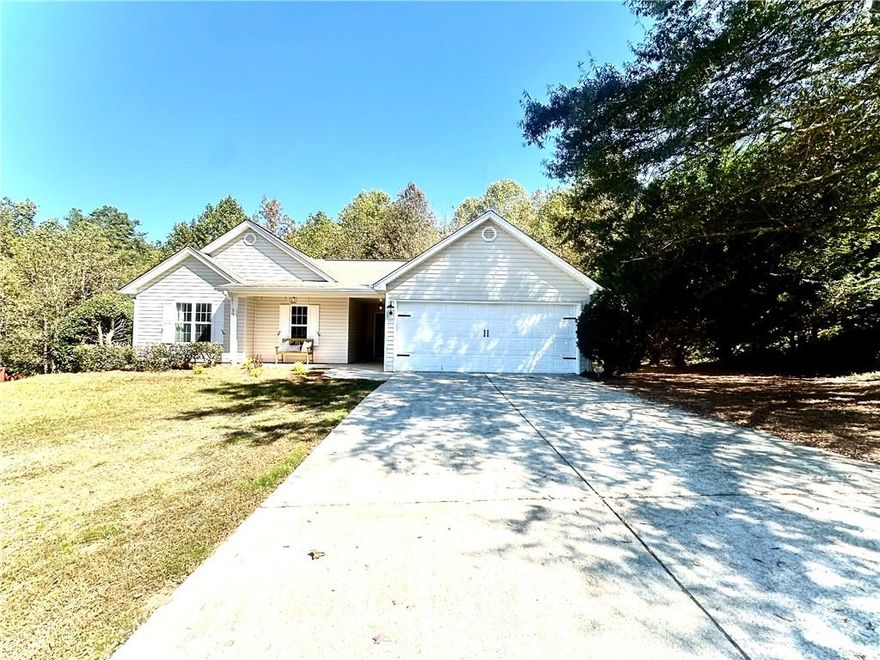 Charming Updated 3/2 Ranch in a Beautiful Setting  Step into this completely refreshed 3-bedroom, 2-bath ranch that blends modern updates with timeless comfort. Inside, you'll find new lighting, fresh paint, updated cabinetry, and flooring throughout, creating a bright and inviting atmosphere. The spacious, open layout feels airy and welcoming perfect for everyday living or entertaining.  Enjoy a private backyard patio complete with an outdoor fireplace, offering a cozy retreat for quiet evenings or gatherings with friends. All appliances including the refrigerator, washer, and dryer are thoughtfully included, making this home truly move-in ready.