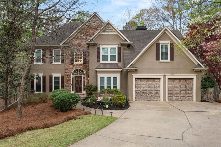Here is your opportunity to own this stunning European executive style home with sophisticated elegance throughout in the sought after Eagle Watch subdivision, a Golf/Swim/Tennis community. Nestled in Eagle Watch on nearly an acre backing up to corps property, you will enjoy nature in your private oasis; you are approximately 700 feet to Lake Allatoona from the property line with seasonal views of the lake, availing you the opportunity for unlimited hiking and kayaking! Full deck with under decking is perfect for hours of rest and relaxation.  This home, the perfect blend of traditional, contemporary, and mountain design, will "WOW" you from the moment you enter the welcoming two story foyer leading to the formal parlor, formal dining room and kitchen - opening up to a custom mountain sunroom. This 3 to 4 season retreat seamlessly integrates the indoors with the outdoors and has Porch 365 custom adjustable windows and door, heating and air conditioning, built-in electric fireplace and overlooks your stunning backyard view, making  you feel like you are living in the mountains all year round. This home has had meticulous attention to detail in its transformation that will amaze you.  Chef's delight kitchen has been redesigned, updated and upgraded with outstanding features from the imported Turkish tile backsplash with brass inlaid, smart appliances, walk-in pantry, soft close doors, upscale hardware, pull out shelves, multi-temperature overhead lighting and so much more. Quartz countertops top the abundant countertop area. You have to see this kitchen to believe.  See the oversized family room with vaulted ceiling and built- in cabinets, gas starter fireplace and remote control solar shades. Breathtaking views of natural beauty become part of the room. Hardwood flooring on all of main levels. Stunning full bathroom and full bedroom on the main level makes the perfect office or guest suite.  Exquisite primary bedroom is a real retreat and has a double sided fireplace, small refrigerator and wine rack, walk-in closet, and a wall of windows with a spectacular view of your wooded backyard and beyond.  The room is large enough to accommodate a sitting area and work space.  The primary bathroom has abundant luxuries: heated floors, cove radiant heater, fireplace, new custom cabinetry vanities with soft close drawers, double vanity with quartz counter tops, double spa hot tub, towel warming rack, and smart Alexa connected bath fan, just to name a few. The large laundry room has a front loading washer and dryer and a collapsible folding table.  In this 5 bedroom -  5 full-bath home, each bedroom tells a story and its own full bath ensuring personal space and privacy for family and guests. All 5 baths have too many features to list but you must see to believe. Heated towel racks, fireplaces, rain showers and smart bath fans are among the features.  The terrace level has all new vinyl plank flooring and is designed for leisure and entertainment, so much to offer from the custom bar with epoxy surface, custom cabinetry and shelving, bar refrigerator in addition to full-size refrigerator, electric wall fireplace, custom bar lighting, wine cellar, and television/living area.  The wellness room with rubberized flooring is the perfect spot for fitness and privacy.  Also on terrace level is a full bedroom with a spacious full bath. Bedroom would make the perfect office, library, in-law suite. Also easily accessible is a spacious storage room. Don't miss the private custom screened-in porch that overlooks your fence backyard oasis and leads to the outside patio with spectacular views.  This home offers privacy, sophistication and an eye for detail with many special features and is a smart home. It has two hot water heaters, 5 refrigerators (3 full size and two mini's), on a quiet cul-de-sac of just 5 homes, new flagstone on front porch and sidewalk to wood plank stairway and partial new stone driveway.  Most windows are new and under warranty.