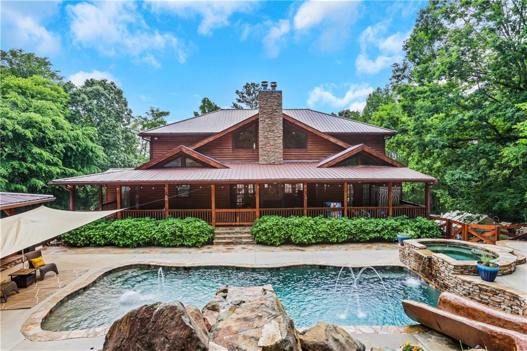 A mix of Rustic charm with modern features includes a backyard oasis for entertaining and the advantage of 6+ acres to create your very own micro-farm. This includes the adjacent lot and the private road. There is a separate water meter installed and ready to set up for the adjacent lot if you want to build a barn with it's own water meter or add another home for a family compound.