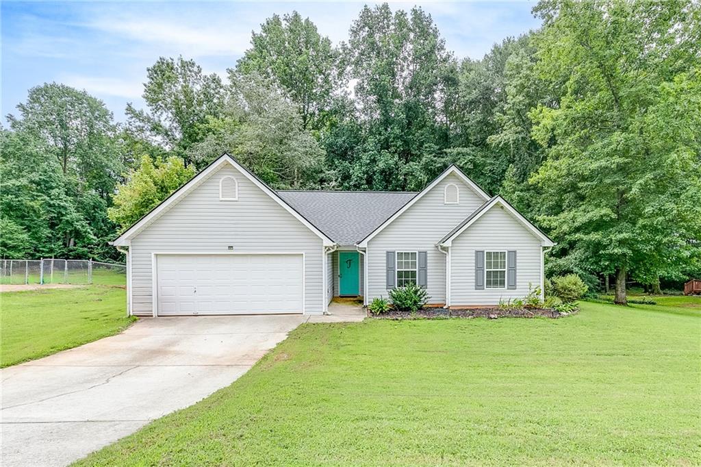 Welcome to this charming 3 bedroom, 2 bath home situated on a spacious .95-acre lot in the quiet Riverwood subdivision—a small, one-street neighborhood with no HOA. This home offers the perfect blend of comfort, style, and convenience.
Inside, you’ll find luxury plank flooring throughout and a bright, open layout. The kitchen features white cabinets and connects to the dining area with sliding glass doors leading to the back deck—ideal for entertaining or enjoying a peaceful morning coffee. The living room boasts vaulted ceilings, abundant natural light, and inviting farmhouse-style paint colors.
The primary suite is a true retreat with its trey ceiling, plentiful natural light, and a spacious bathroom complete with a large double-sink vanity, walk-in shower, separate soaking tub, and ample storage.
Outside, the property features a fenced backyard with mature trees and shrubs, plus a grassy front yard. With low-maintenance vinyl siding and a location that’s conveniently nestled between Jefferson and Commerce, this home offers both practicality and charm.
Don’t miss your chance to own this move-in ready home in a peaceful, tucked-away setting!